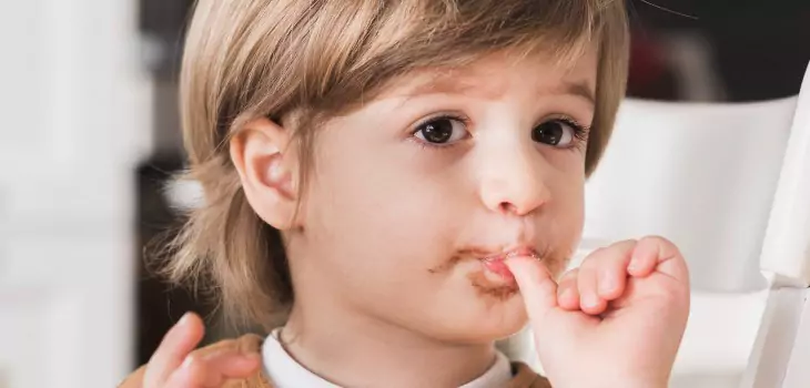 young kid sucking his thumb