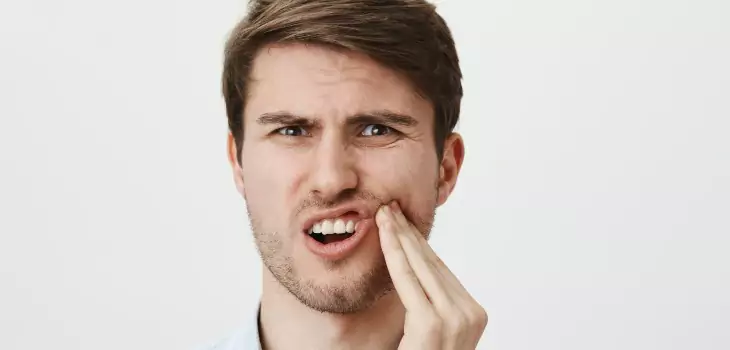 young man looking in pain