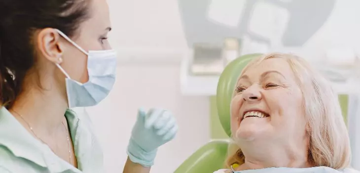 old age woman during the oral treatment