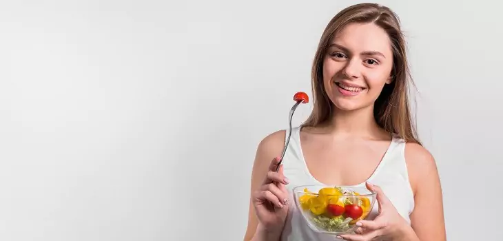 woman with a bowl of healthy food