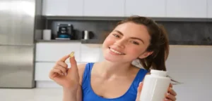 a young woman is having vitamins for healthy teeth