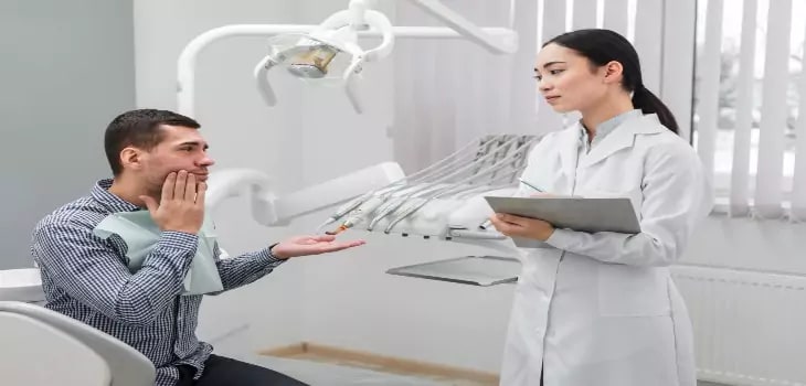 a young man visits dentists in Hope Island