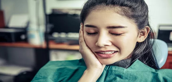 a girl is feeling numbness and swelling after dental work