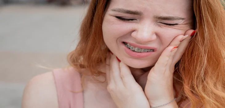 Close-up of young woman with braces