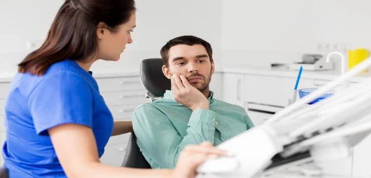 Patient with toothache at dentist office